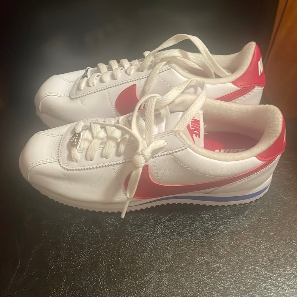 Red blue and white Nikes